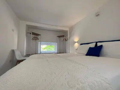 Letto o letti in una camera di Via Giardini Rooms