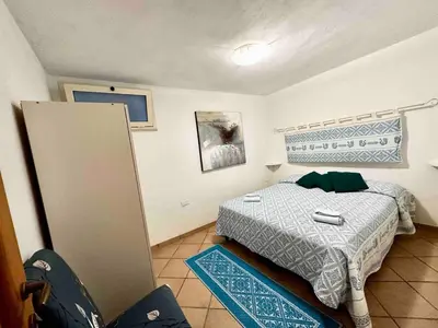 Letto o letti in una camera di Casa vacanze Campulongu a 150 mt dal mare, Villa Carolina