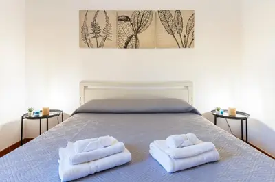 Letto o letti in una camera di La Casetta di Luisa - Affitti Brevi Italia