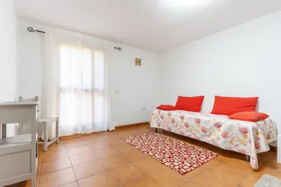 Letto o letti in una camera di La Casetta di Luisa - Affitti Brevi Italia