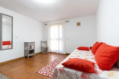 Letto o letti in una camera di La Casetta di Luisa - Affitti Brevi Italia