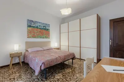 Letto o letti in una camera di GuestHost - Cagliari Comfy Apartment with Terrace & Netflix!