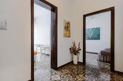 Planimetria di GuestHost - Cagliari Comfy Apartment with Terrace & Netflix!