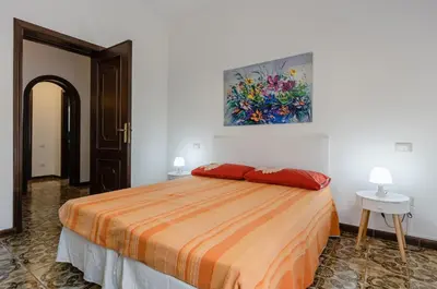 Letto o letti in una camera di GuestHost - Cagliari Comfy Apartment with Terrace & Netflix!