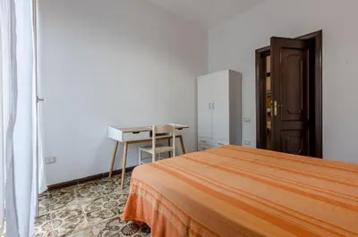 Letto o letti in una camera di GuestHost - Cagliari Comfy Apartment with Terrace & Netflix!