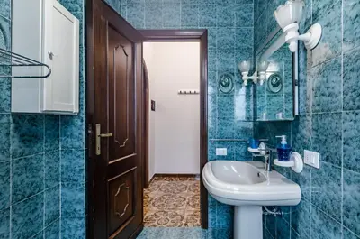 Bagno di GuestHost - Cagliari Comfy Apartment with Terrace & Netflix!