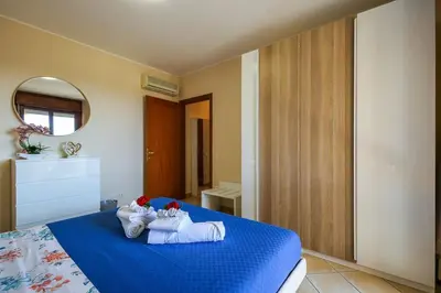 Letto o letti in una camera di Uno sguardo sul mare - Apartment -