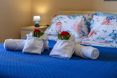 Letto o letti in una camera di Uno sguardo sul mare - Apartment -