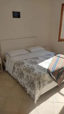 Letto o letti in una camera di Villa mimosa