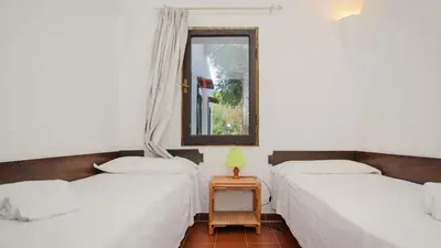 Letto o letti in una camera di Villa Chiara