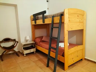 Letto o letti a castello in una camera di Casa Marta