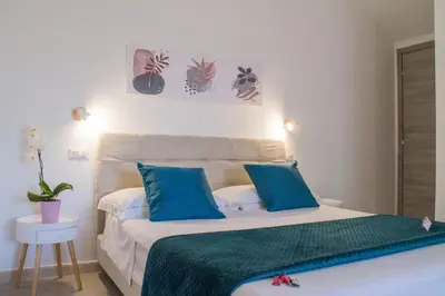 Letto o letti in una camera di B&B Jolie Suite