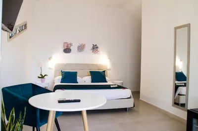 Letto o letti in una camera di B&B Jolie Suite
