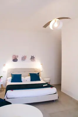 Letto o letti in una camera di B&B Jolie Suite
