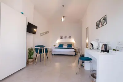 Letto o letti in una camera di B&B Jolie Suite