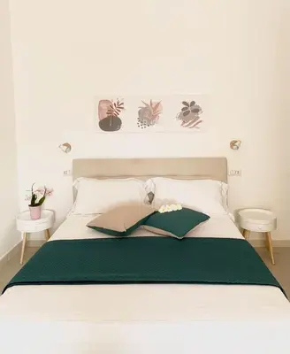 Letto o letti in una camera di B&B Jolie Suite