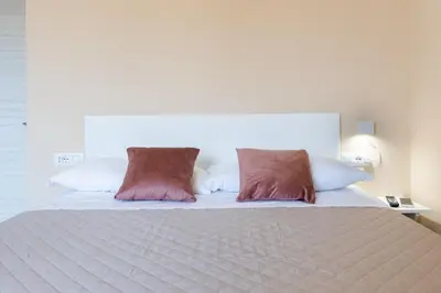 Letto o letti in una camera di Bonnystudios Holiday Apartments