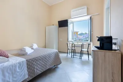 Letto o letti in una camera di Bonnystudios Holiday Apartments