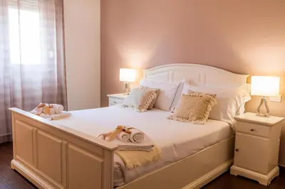 Letto o letti in una camera di Arcobaleno Suites