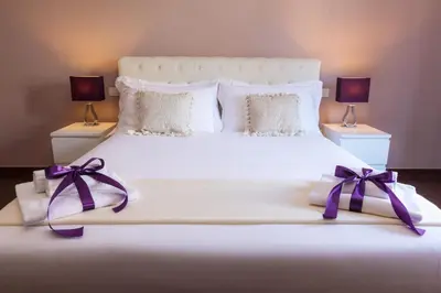 Letto o letti in una camera di Arcobaleno Suites