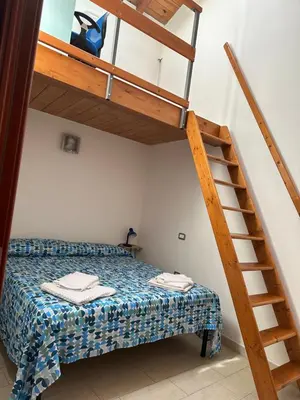 Letto o letti in una camera di Stylish Loft Trivano Cagliari 2 beds/2 bath