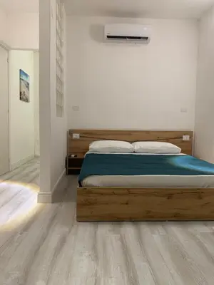 Letto o letti in una camera di CagliariParadiseApartment it Marina