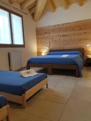 Letto o letti in una camera di Agriturismo Corte degli Ulivi