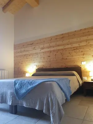 Letto o letti in una camera di Agriturismo Corte degli Ulivi