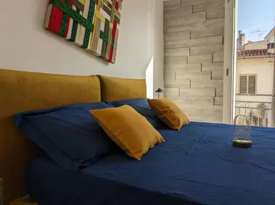 Letto o letti in una camera di Santeria Modern Loft