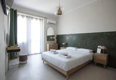 Letto o letti in una camera di Isola dei Racconti - Guesthouse - Apartment