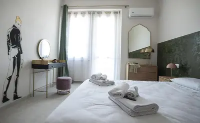 Letto o letti in una camera di Isola dei Racconti - Guesthouse - Apartment