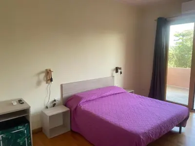 Letto o letti in una camera di VILLA ARYA