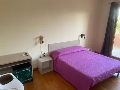 Letto o letti in una camera di VILLA ARYA