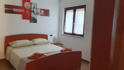 Letto o letti in una camera di Domus Mariposa