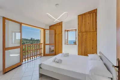 Letto o letti in una camera di Villa Perla Marina