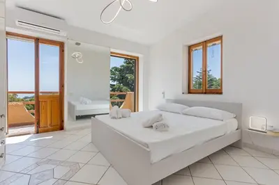 Letto o letti in una camera di Villa Perla Marina