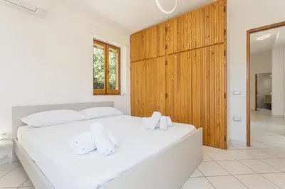 Letto o letti in una camera di Villa Perla Marina