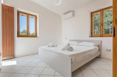 Letto o letti in una camera di Villa Perla Marina