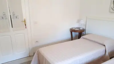 Letto o letti in una camera di Dante Alighieri Guest House