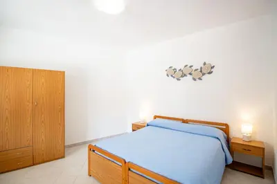 Letto o letti in una camera di SA DOMU DE S'ORTU