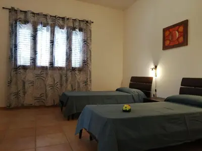 Letto o letti in una camera di Casa Alpamar