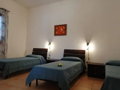 Letto o letti in una camera di Casa Alpamar