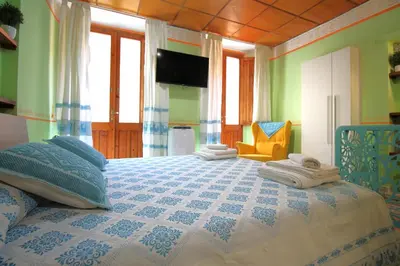 Letto o letti in una camera di La piccola Stampace Cagliari
