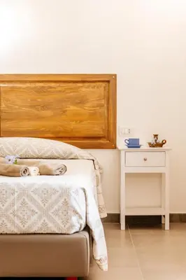 Letto o letti in una camera di Domo Mediterranea Affittacamere-Guest House