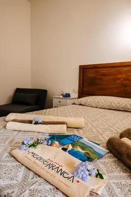 Letto o letti in una camera di Domo Mediterranea Affittacamere-Guest House