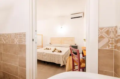 Letto o letti in una camera di Domo Mediterranea Affittacamere-Guest House
