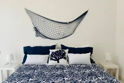 Letto o letti in una camera di Seven House Poetto