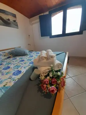Letto o letti in una camera di Casa Giola