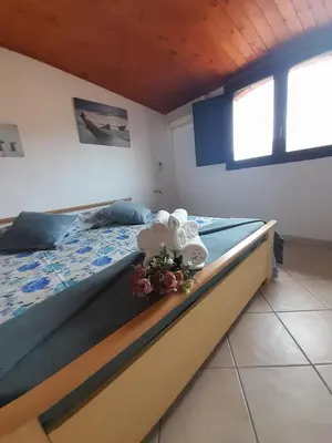 Letto o letti in una camera di Casa Giola