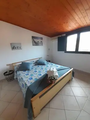 Letto o letti in una camera di Casa Giola